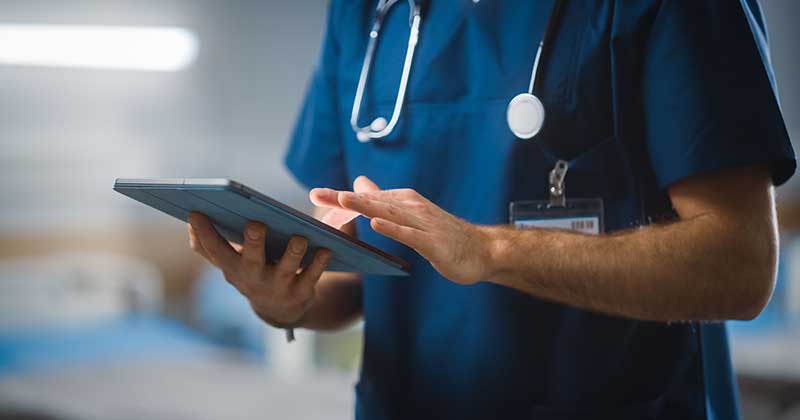 Doctor using iPad EHR