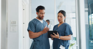 Medical advice, help and doctors with a tablet for healthcare, research and medicine planning. Communication, collaboration and men working in cardiology talking about surgery results on technology.